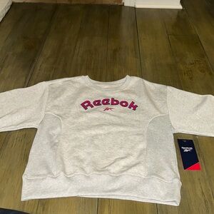 Brand new with tags Reebok sweatshirt. Girls size xl (12)